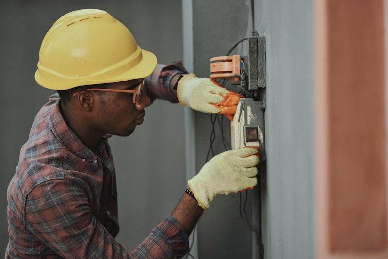 Technician testing a residential HVAC electrical panel